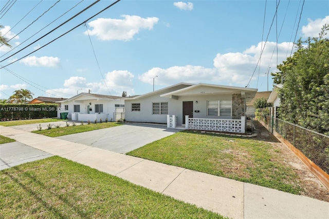 2650 SW 76th Ave, Miami, FL 33155 - view of front facade featuring covered porch, driveway, and stucco siding