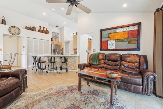 living room featuring light tile patterned floors, high vaulted ceiling, a ceiling fan, and recessed lighting