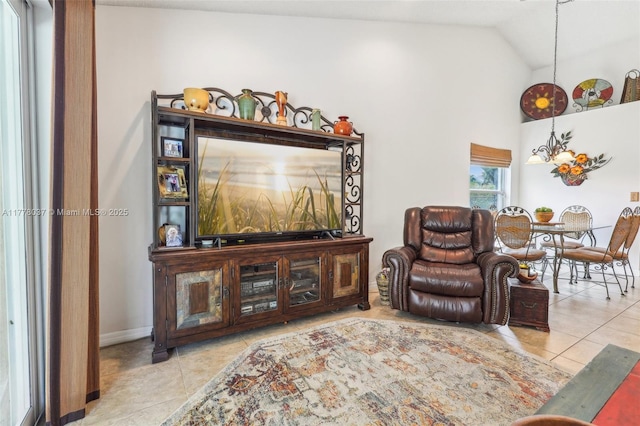 tiled living room with baseboards and vaulted ceiling