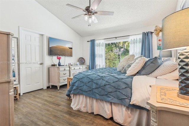 bedroom with a textured ceiling, wood finished floors, ceiling fan, and lofted ceiling