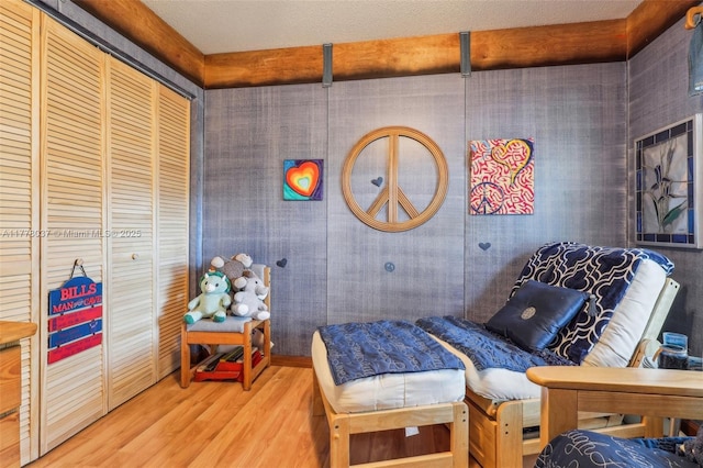 bedroom with a closet and wood finished floors