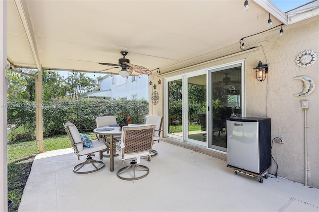 view of patio / terrace with outdoor dining area and ceiling fan