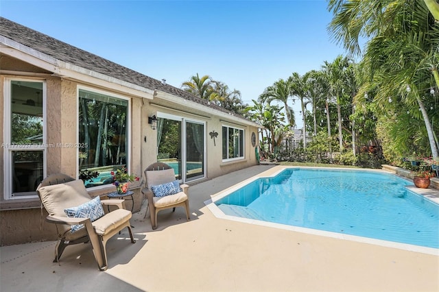 pool with a patio