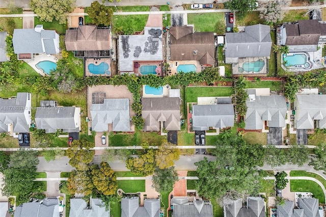 birds eye view of property with a residential view