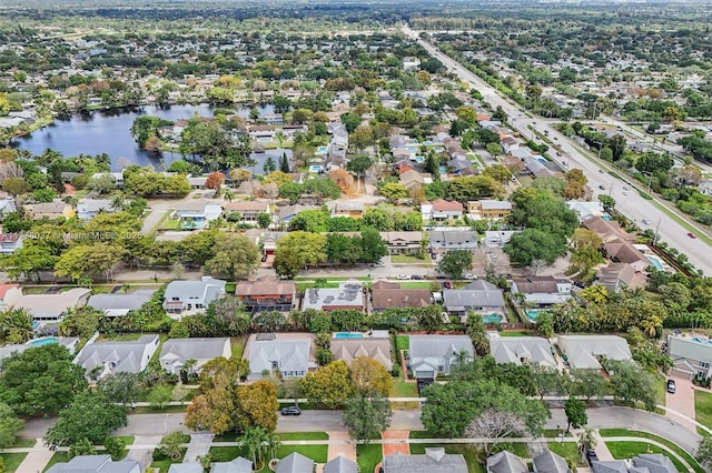 aerial view with a water view and a residential view