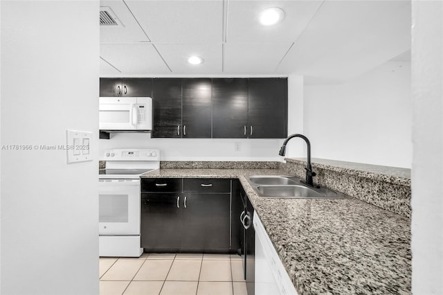 2821 SW 87th Ave Unit 808, Davie, FL 33328 - kitchen featuring visible vents, a sink, white appliances, dark cabinetry, and recessed lighting