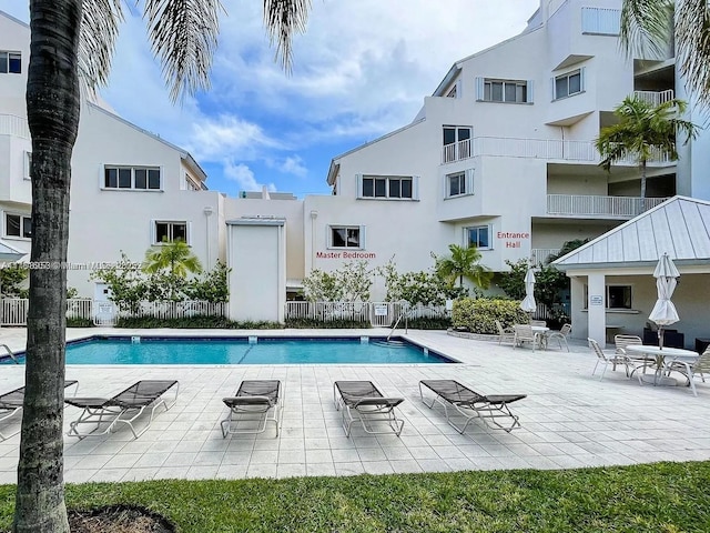 50 Ocean Lane Dr Unit 101, Key Biscayne, FL 33149 - community pool with a patio and fence