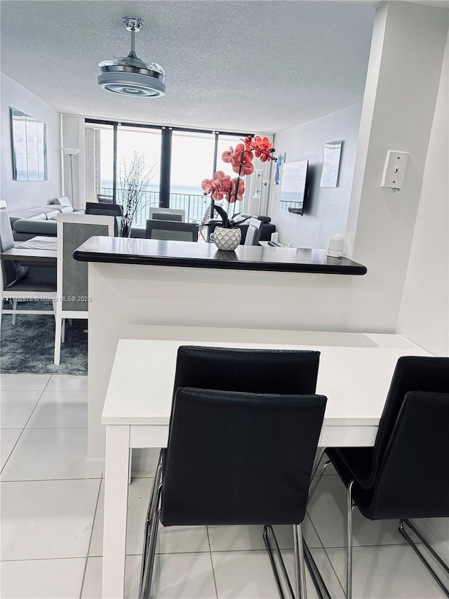 2101 S Ocean Dr Unit 1902, Hollywood, FL 33019 - kitchen with white cabinets, open floor plan, a textured ceiling, and a healthy amount of sunlight