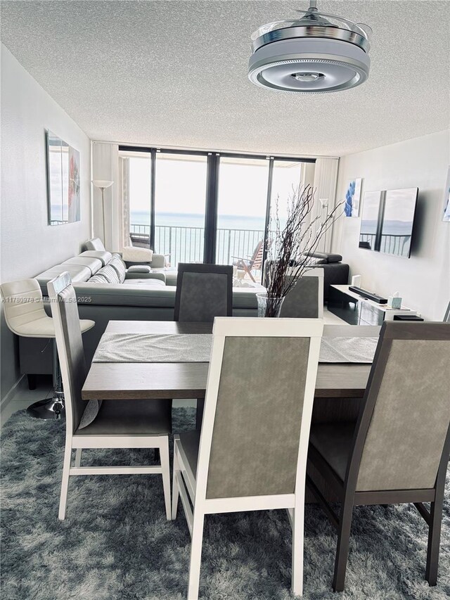 2101 S Ocean Dr Unit 1902, Hollywood, FL 33019 - carpeted dining area with a textured ceiling and a water view