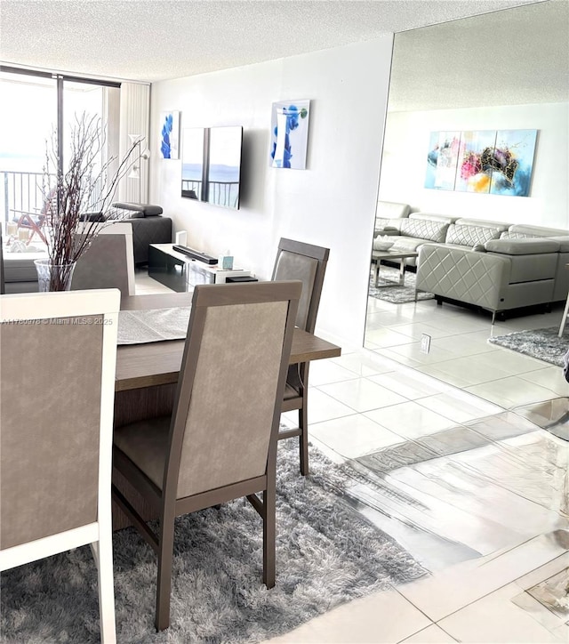 2101 S Ocean Dr Unit 1902, Hollywood, FL 33019 - dining room with a textured ceiling, light tile patterned floors, and a healthy amount of sunlight
