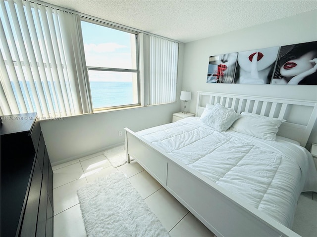 2101 S Ocean Dr Unit 1902, Hollywood, FL 33019 - bedroom with a textured ceiling and light tile patterned floors