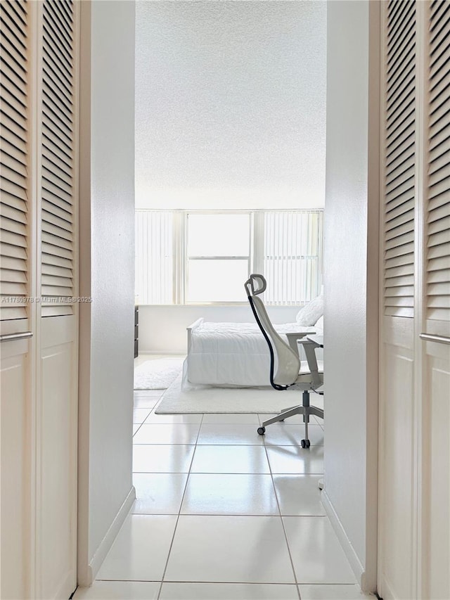 2101 S Ocean Dr Unit 1902, Hollywood, FL 33019 - bedroom with tile patterned floors, baseboards, and a closet