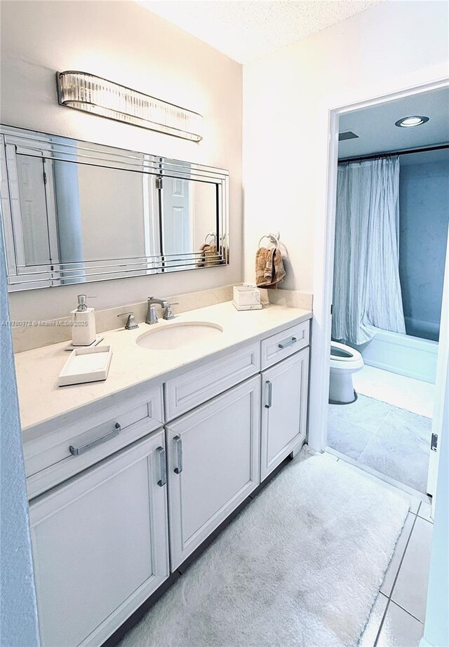 2101 S Ocean Dr Unit 1902, Hollywood, FL 33019 - full bath featuring shower / bath combo, a textured ceiling, toilet, tile patterned flooring, and vanity