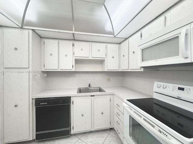3800 S Ocean Dr Unit 1114, Hollywood, FL 33019 - kitchen featuring white appliances, light marble finish floors, light countertops, and white cabinets