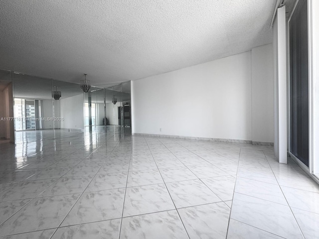 3800 S Ocean Dr Unit 1114, Hollywood, FL 33019 - spare room featuring a textured ceiling