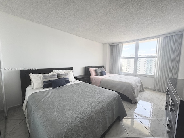 3800 S Ocean Dr Unit 1114, Hollywood, FL 33019 - bedroom featuring baseboards and a textured ceiling