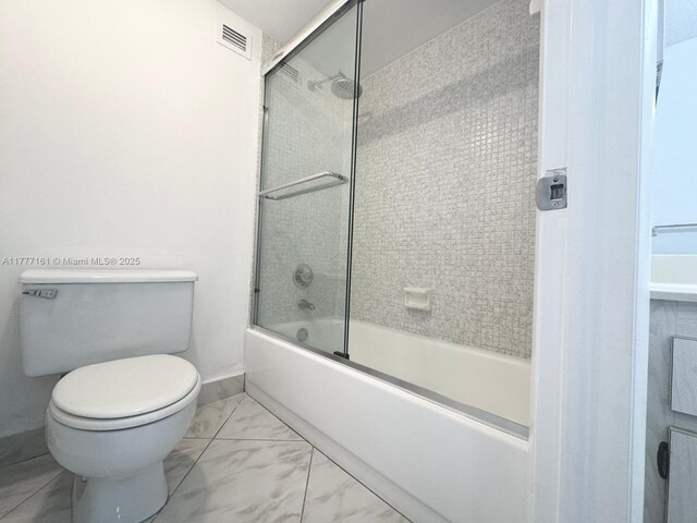 3800 S Ocean Dr Unit 1114, Hollywood, FL 33019 - bathroom with bath / shower combo with glass door, visible vents, baseboards, toilet, and marble finish floor