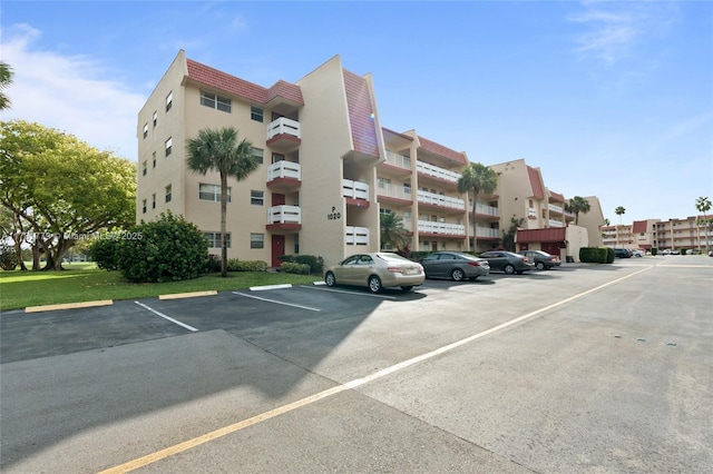 1020 Country Club Dr Unit 206, Margate, FL 33063 - view of property with uncovered parking