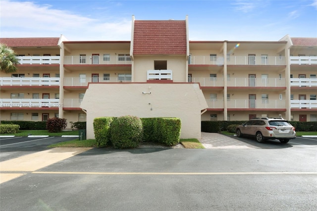 1020 Country Club Dr Unit 206, Margate, FL 33063 - view of property with uncovered parking
