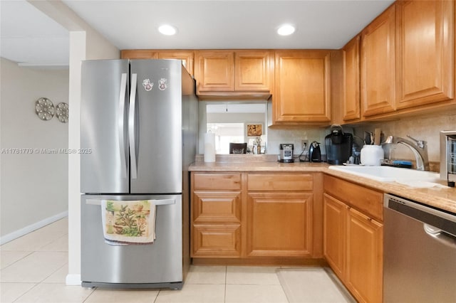 1020 Country Club Dr Unit 206, Margate, FL 33063 - kitchen featuring stainless steel appliances, light tile patterned floors, light countertops, and a sink