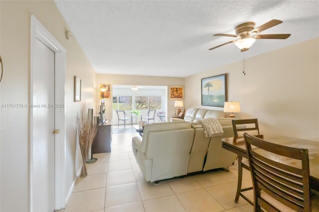 1020 Country Club Dr Unit 206, Margate, FL 33063 - living area featuring ceiling fan, light tile patterned flooring, and a textured ceiling