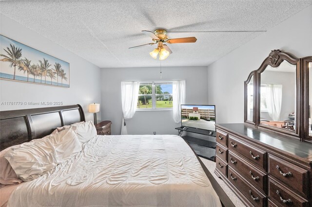 1020 Country Club Dr Unit 206, Margate, FL 33063 - bedroom with a textured ceiling and a ceiling fan