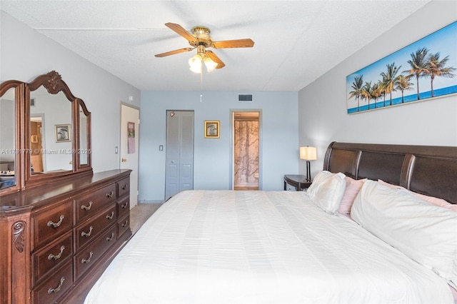 1020 Country Club Dr Unit 206, Margate, FL 33063 - bedroom with visible vents, a textured ceiling, connected bathroom, and ceiling fan