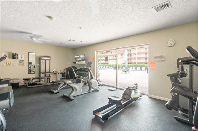 1020 Country Club Dr Unit 206, Margate, FL 33063 - workout area featuring baseboards, visible vents, a textured ceiling, and a ceiling fan