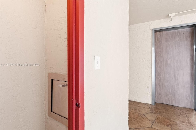 1020 Country Club Dr Unit 206, Margate, FL 33063 - hall featuring a textured wall