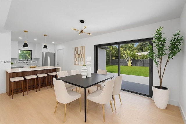 185 NE 106th St, Miami Shores, FL 33138 - dining room featuring light wood-style floors, recessed lighting, and a chandelier