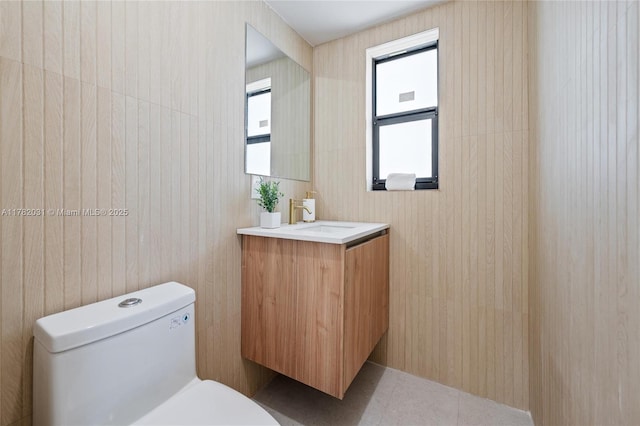 bathroom featuring toilet and vanity