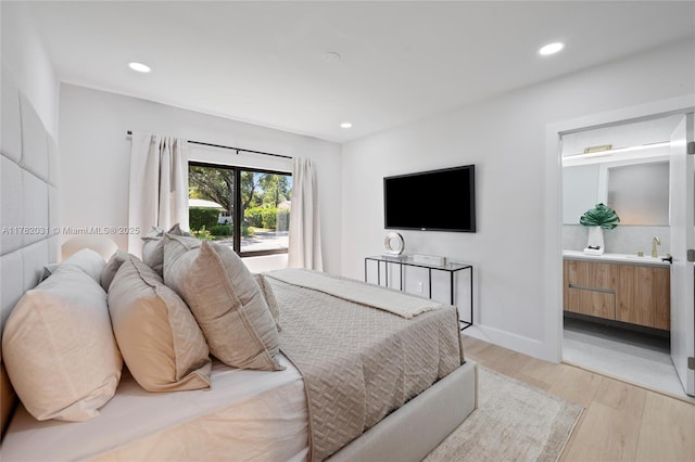 185 NE 106th St, Miami Shores, FL 33138 - bedroom with light wood-type flooring, recessed lighting, and connected bathroom