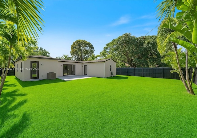185 NE 106th St, Miami Shores, FL 33138 - fenced backyard with a patio