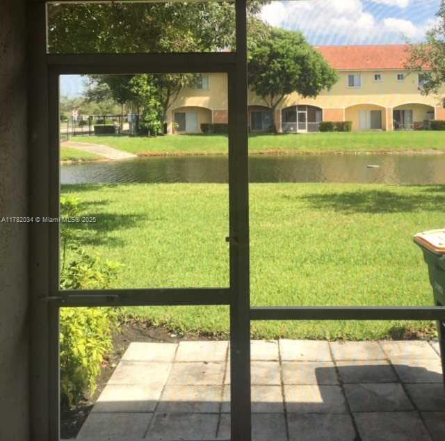 8066 Sanibel Dr Unit 8066, Tamarac, FL 33321 - entryway featuring a water view