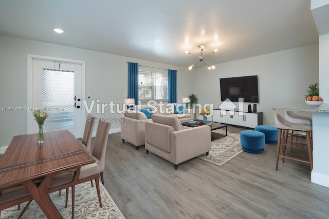 494 Monaco K Unit 494, Delray Beach, FL 33446 - living area featuring light wood-style flooring, a notable chandelier, and baseboards