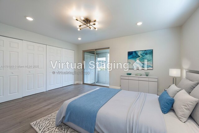 494 Monaco K Unit 494, Delray Beach, FL 33446 - bedroom with baseboards, recessed lighting, an inviting chandelier, and wood finished floors