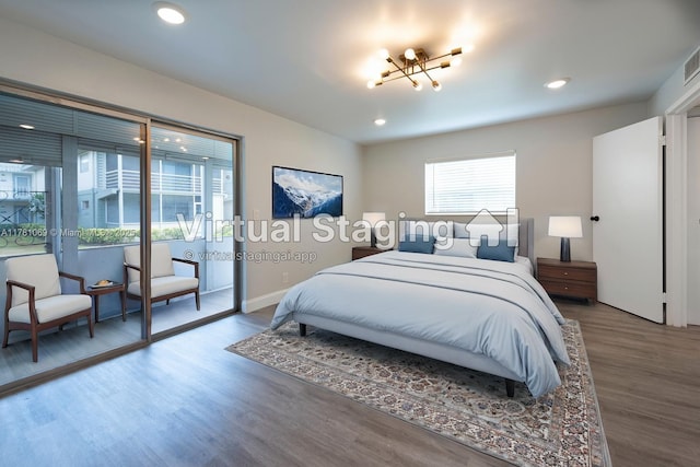 494 Monaco K Unit 494, Delray Beach, FL 33446 - bedroom featuring a notable chandelier, baseboards, recessed lighting, visible vents, and wood finished floors