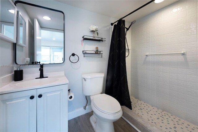 494 Monaco K Unit 494, Delray Beach, FL 33446 - full bathroom with toilet, a tile shower, vanity, and wood finished floors