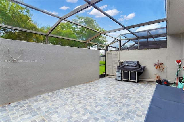 view of patio / terrace with glass enclosure