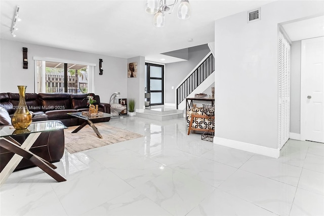 living room featuring marble finish floor, stairway, visible vents, and baseboards