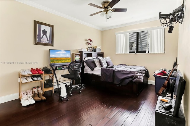 bedroom with crown molding, wood finished floors, baseboards, and a ceiling fan