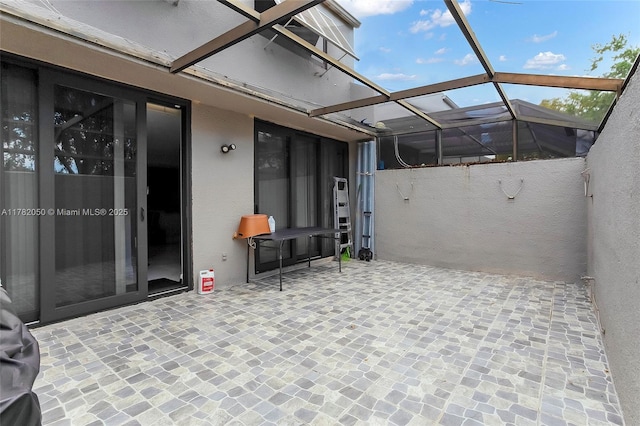 view of patio / terrace with a lanai