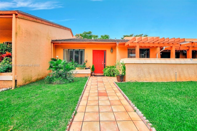 861 NW 79th Ter, Plantation, FL 33324 - exterior space with a yard, a pergola, and stucco siding