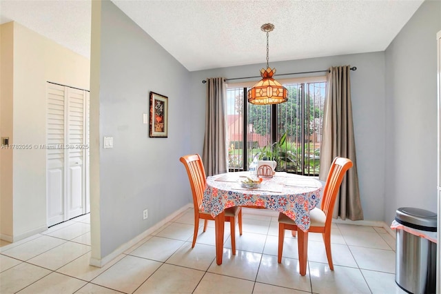 861 NW 79th Ter, Plantation, FL 33324 - dining space with baseboards, light tile patterned flooring, and a textured ceiling