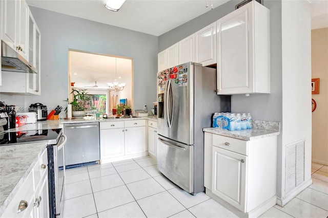 861 NW 79th Ter, Plantation, FL 33324 - kitchen featuring visible vents, white cabinets, and stainless steel appliances