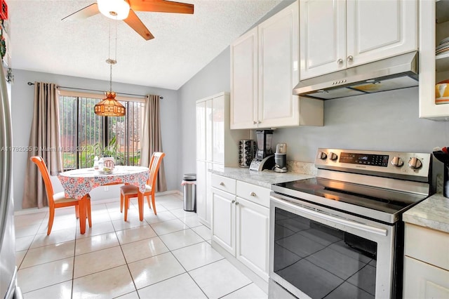 861 NW 79th Ter, Plantation, FL 33324 - kitchen featuring light tile patterned floors, a textured ceiling, under cabinet range hood, light countertops, and stainless steel electric range