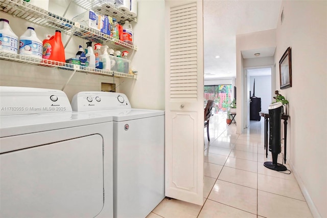 861 NW 79th Ter, Plantation, FL 33324 - clothes washing area with visible vents, baseboards, separate washer and dryer, laundry area, and light tile patterned flooring
