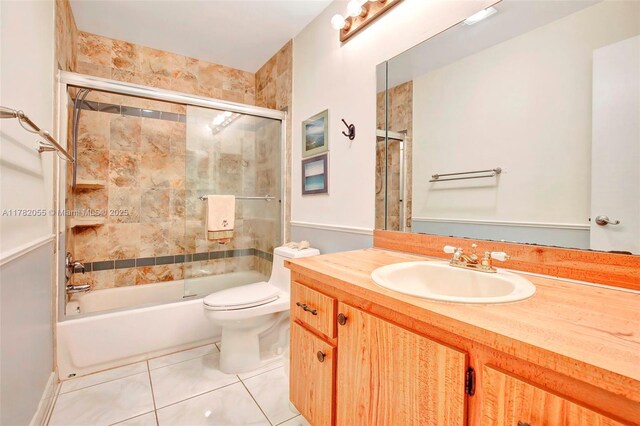 861 NW 79th Ter, Plantation, FL 33324 - full bathroom featuring tile patterned flooring, vanity, shower / bath combination with glass door, and toilet