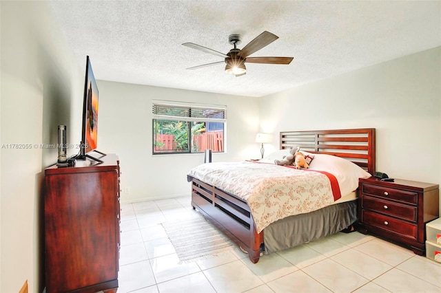861 NW 79th Ter, Plantation, FL 33324 - bedroom featuring light tile patterned floors, ceiling fan, and a textured ceiling