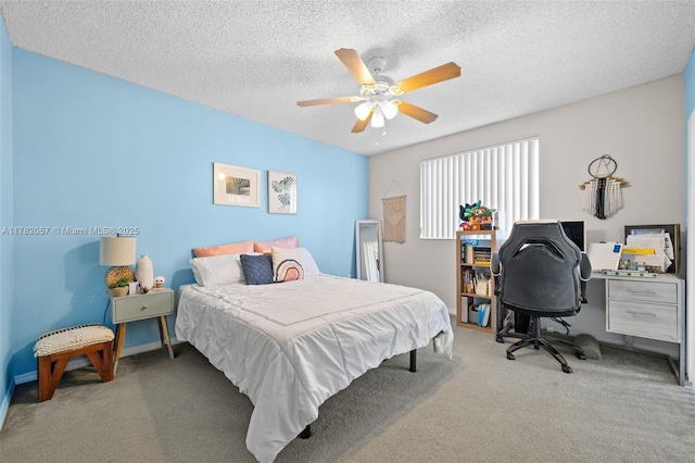 carpeted bedroom featuring a textured ceiling and ceiling fan